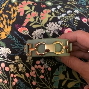 Mint green cuff bracelet with no maker mark. Query leather? Gold hardware.